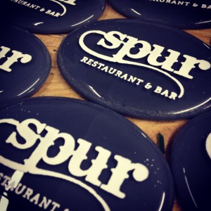 Keep your eyes out for a MADE belt buckle on your server at Spur, Cafe Genevieve and Snake River Grill.