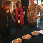 Chris shows Annie and Christina how to sprout your own garbanzo beans at home. 