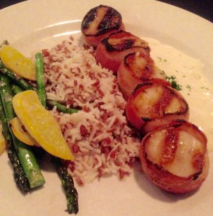Bacon wrapped sea scallops with basmati rice and veggies