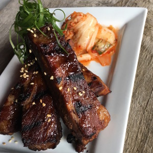 Korean barbecue ribs with house-made kimchi. These ribs are great to share or as a meal with a side of rice or naan.