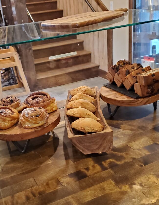 Every morning, Wanderlust Bistro serves up a diverse array of freshly-baked goodies: Cinnamon Rolls, Scones, Breads, and more.